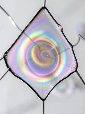 Soap film on a triangular wire frame, Plateau borders dark at edges, center memb