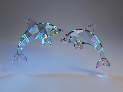 Pair of faceted sapphire glass dolphins arcing gracefully over a low gradient wi