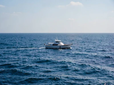 Single boat on vast sea