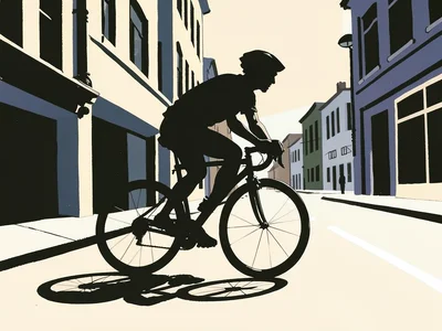 Cyclist in motion on a city street, bold graphic silhouette and cast shadow