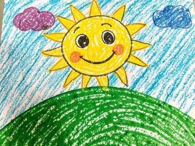 Smiling sun over green hill