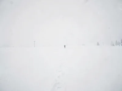 Single figure tiny in vast white