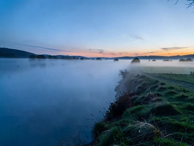Fog bank edge creating sharp line across landscape