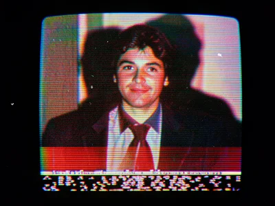 Paused tape showing head-switching noise at bottom of frame, thin band of scramb