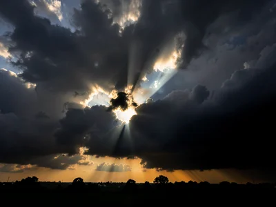 Sunset beam through storm clouds