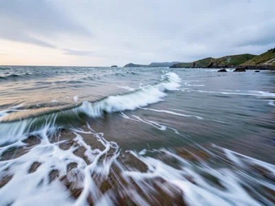 Incoming tide as gradual soft encroachment