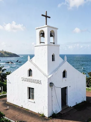 Sunday stillness in Nuku'alofa, Tonga, White painted concrete church with simple