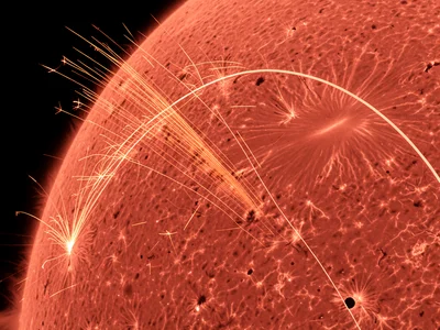 Grinding wheel on metal, fan of orange sparks spraying in parabolic arc