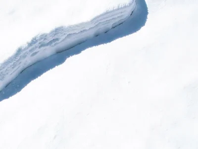 Snow drift edge creating shadow