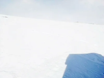 Blue shadow at edge of white expanse