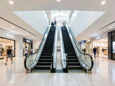 Escalators in minimalist mall