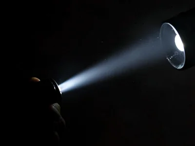 Flashlight beam in dark space