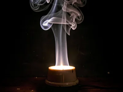 Heat rising from lamp creating continuous convection