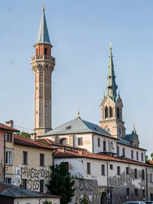 Minaret beside cathedral spire