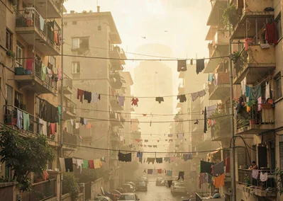 Dusty golden Cairo haze compressing apartment layers, laundry lines between buil
