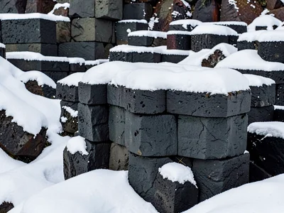 Snow collecting on horizontal column tops