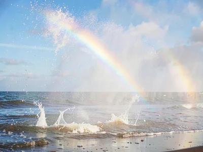 Spray catching light creating rainbow