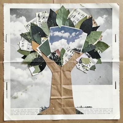 A tree built from layered paper scraps — music sheets for leaves, brown paper ba