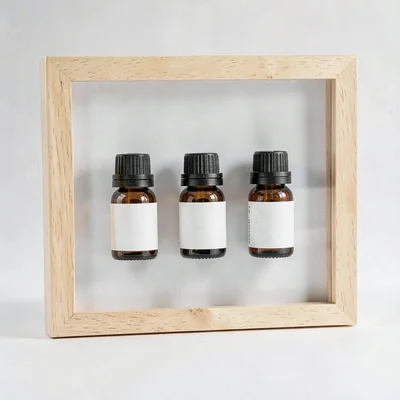 Lightbox of a flight of five small bottles arranged on white seamless