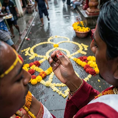 Priest applying tilak