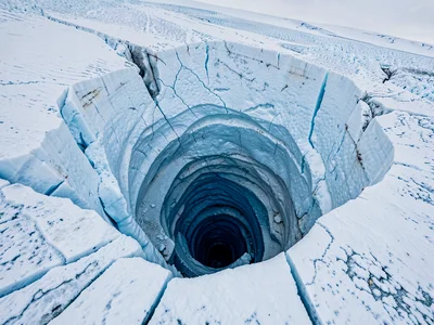 Moulin spiral descending into blue dark
