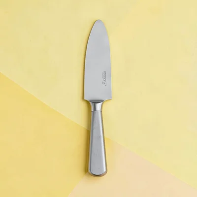 Flat blockcolor design of a butter knife in flat steel-grey on a butter-yellow g