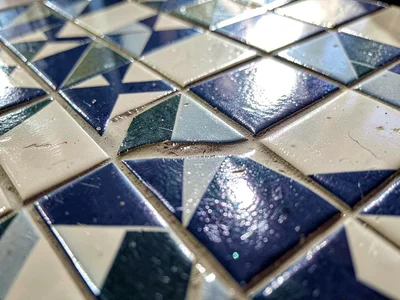 Tilework catching light at angle revealing texture
