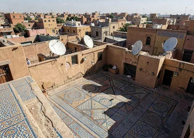 Geometric shadow play in Marrakech medina, medina rooftop view with satellite di