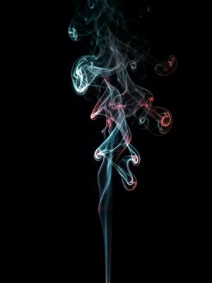 A single thin stream of smoke rising through a sunbeam in a dark room, each part
