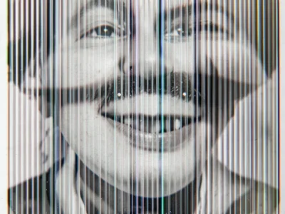 Lenticular print photographed at transition angle, two images simultaneously vis
