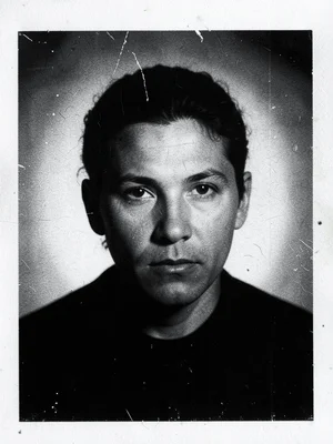 A tissue print: a portrait on very thin paper, the paper fiber visible, transluc