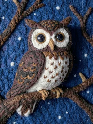 Owl on branch with big eyes