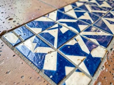 Tile pattern meeting different surface material