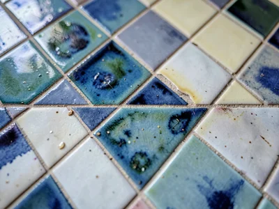 Zellige surface showing handmade irregularity in glaze