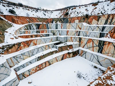 Snow collecting on horizontal quarry surfaces
