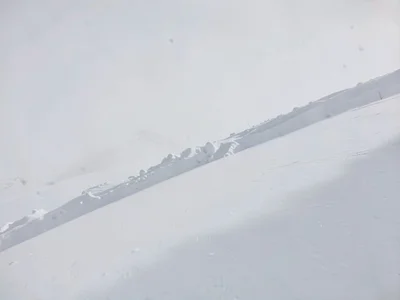 Wind drift edge creating subtle shadow