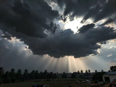 Dark sky over sunlit foreground contrast