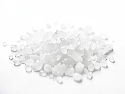 Salt crystals on white surface