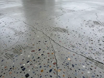 Polished concrete floor, ground smooth revealing aggregate cross-sections, terra