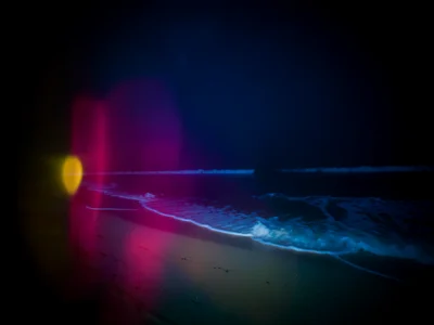 Light-leaked exposure of summer beach, magenta and yellow halation