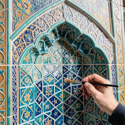 Isfahan Safavid tilework, turquoise geometric infinity, Craftsman applying turqu