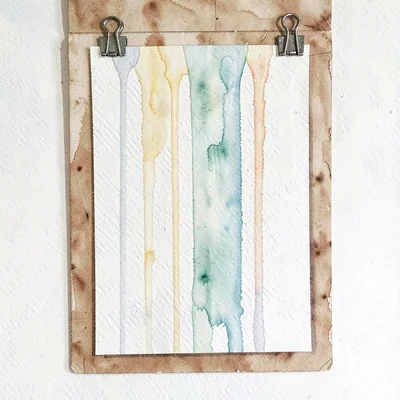 Vertical watercolor of a tall sheet pinned with bulldog clips to a board, pigmen