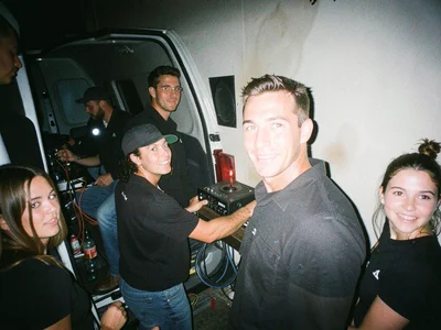 Band loading gear into a van at 2am