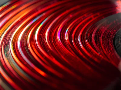 Colored vinyl groove, translucent red PVC showing light through thin groove wall