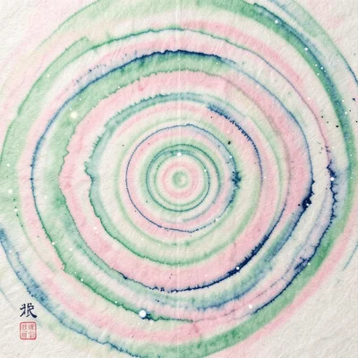 Suminagashi marble pattern in spring greens and cherry pink, floating ink on wat