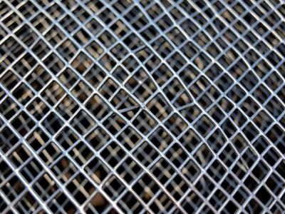 Expanded metal sheet, diamond-shaped openings created by slitting and stretching