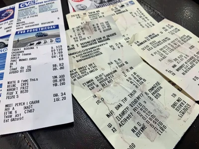 Gas station receipts arranged by date, tracking the road trip, the fuel narrativ