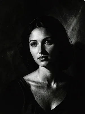 Woman emerging from shadow