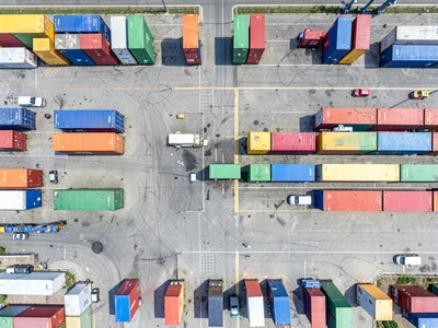 Container shipping yard, multicolored boxes in tetris-like arrangement