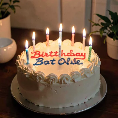 Birthday cake candles glowing